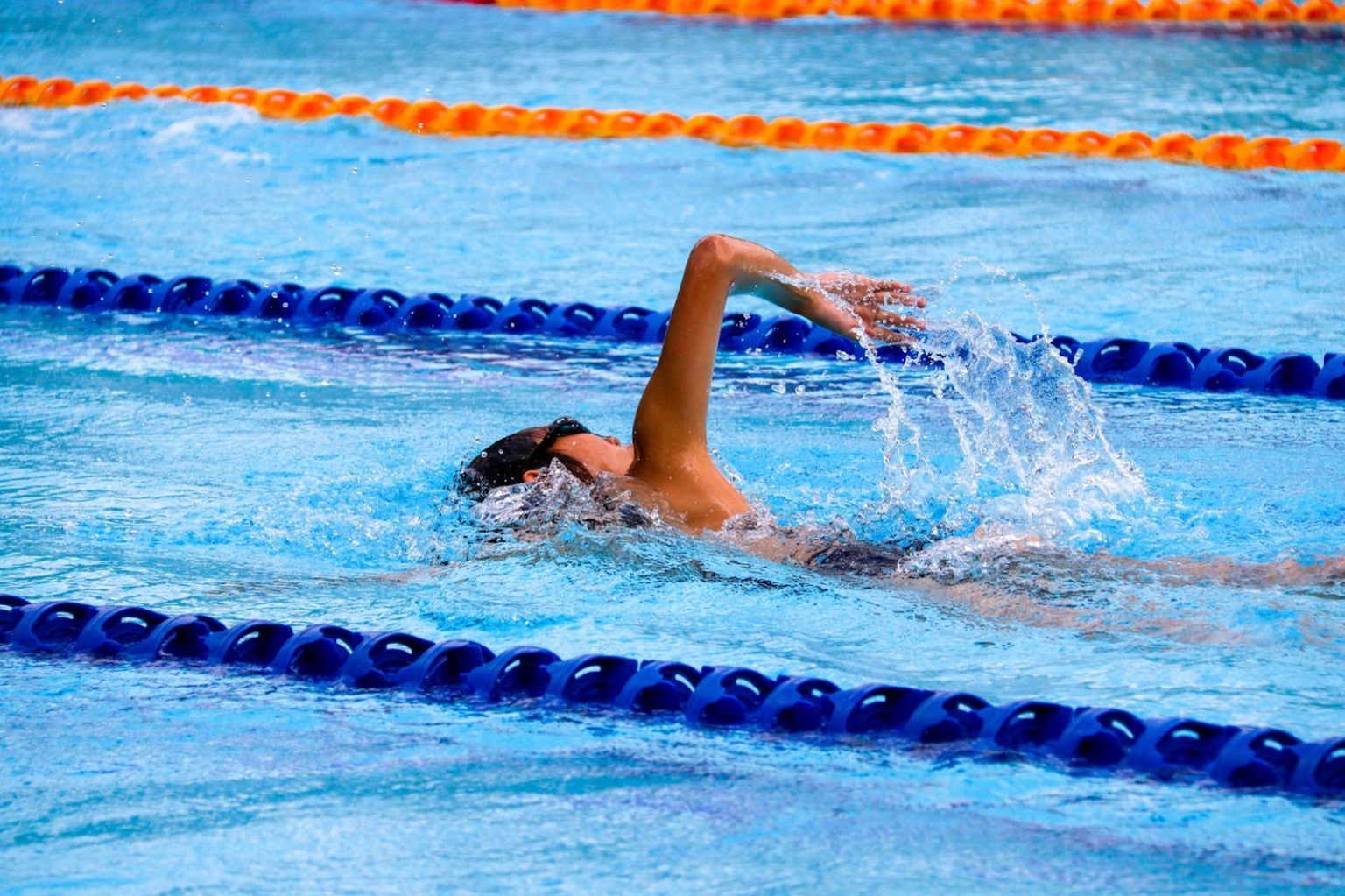 Cynergi Health & Fitness | Why Swimming Is Beneficial To Your Physical Health | Person Swimming